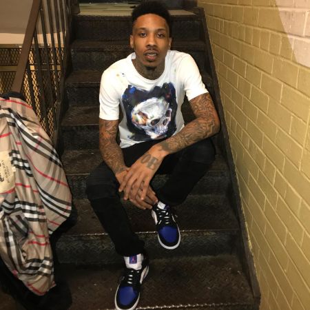Ant Glizzy took a picture on a staircase and later posted it on Facebook.